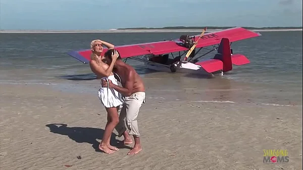 Passionate fucking on the beach with a stunning blonde with big tits