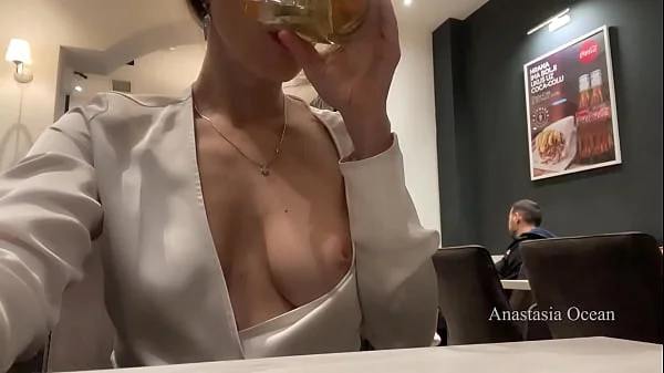 Flashing boobs and pussy in a cafe. No panties, upskirt in public.