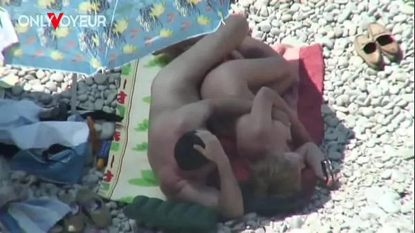 Beach Voyeur. Mature couple fucking under the shining sun