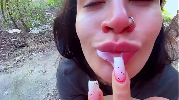 Sucking in public outdoors near people and getting hot sticky cum in her mouth