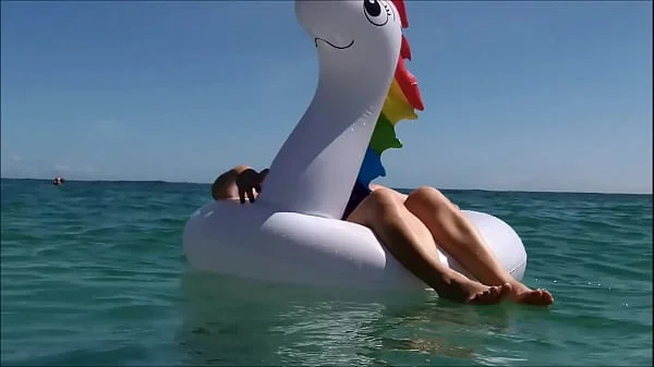 my husband, my unicorn and me in erotic play on a public beach