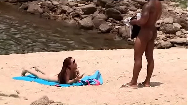 Black dude looks for horny babes at the nude beach and bangs one of 'em