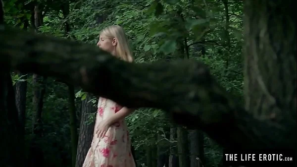 Skinny girl fucks herself hard in the forest